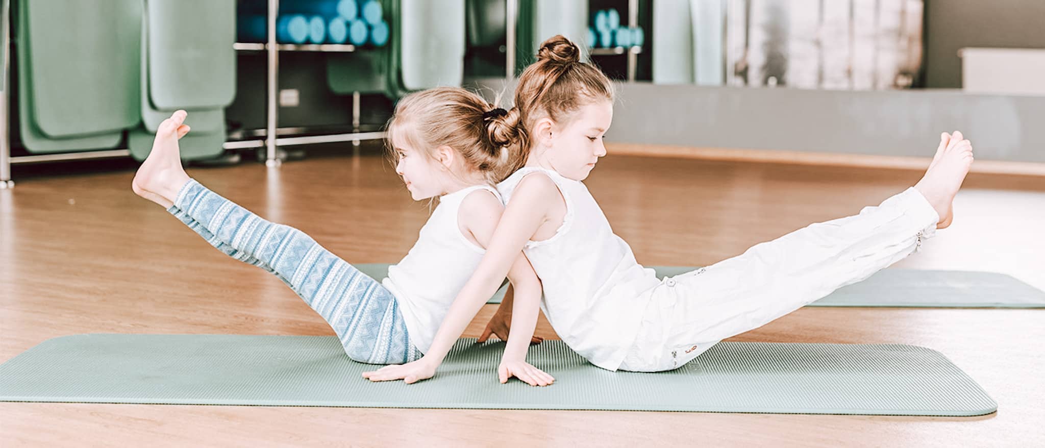 two young girls practicing yoga for ADHD help heal adults add and