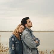 couple in conflict not looking at each other, back to back, outdoor