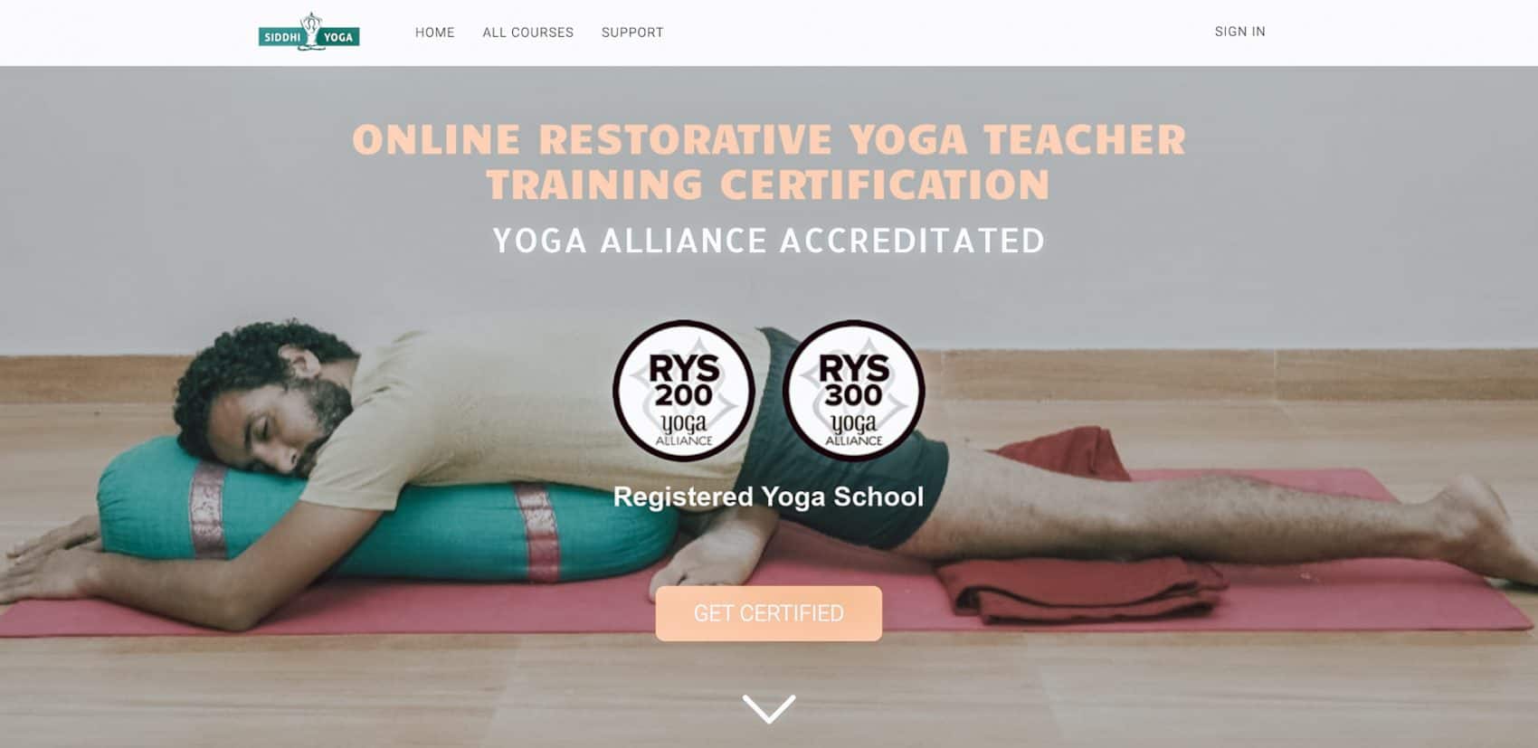 screenshot website index page man on floor holding yoga bolster Yoga Instructor Courses Online
